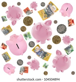 Piggy Banks And Australian Money Falling Over White Background.