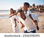 Piggyback, playing and black family at beach for fun on tropical vacation, travel or getaway. Smile, bonding and African children with parents by ocean or sea on holiday, adventure or weekend trip.