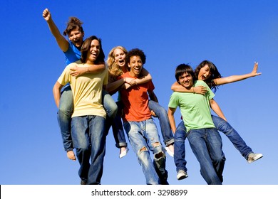 Piggyback Race Diverse Group Of Teens Teenagers At Summer Camp