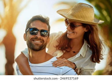 Piggyback, smile and travel with couple on beach together for anniversary, date or romance in summer. Holiday, love or vacation with happy man and woman on tropical island paradise for honeymoon - Powered by Shutterstock