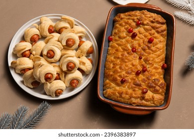 Pigs in a blanket, traditional festive Christmas food on the table. - Shutterstock ID 2396383897