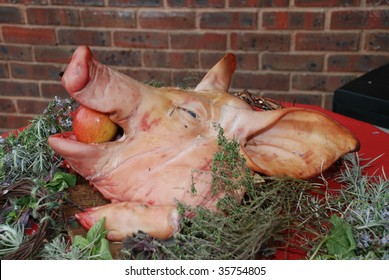 A Pigs Head With An Apple In Its Mouth At A Medieval Style Banquet.