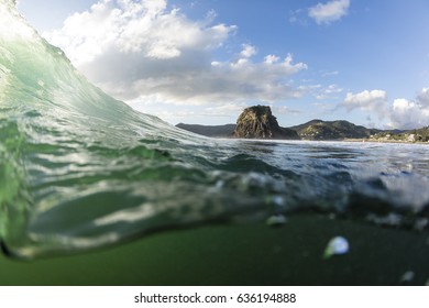 Piha Surf/ Good Surf Breaking At Piha Beach With The Iconic Lion Rock In The Background 