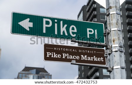Pike Place Market street sign at  at Pike Place Public Market in Seattle : home to the original Starbucks coffee shop.