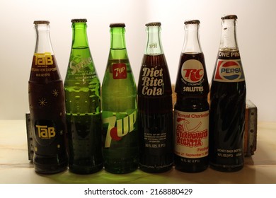 Pikeville, KY United States - June 19th, 2022: Antique Soda Bottles Still Full With A Wooden Pepsi Crate. 