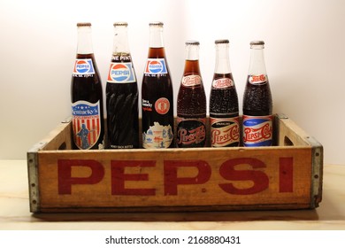 Pikeville, KY United States - June 19th, 2022: Antique Soda Bottles Still Full With A Wooden Pepsi Crate. 