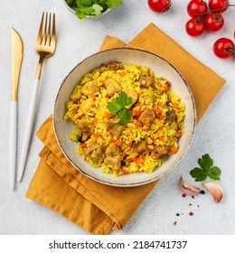 Pilaf With Chicken On A Plate On A White Background.