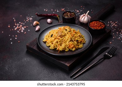 Pilaf With Chicken. Traditional Oriental Hot Dish Of Boiled Rice, Chicken Meat, Vegetables And Spices In A Plate