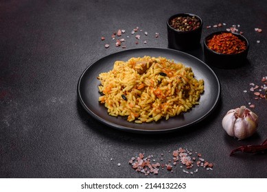 Pilaf With Chicken. Traditional Oriental Hot Dish Of Boiled Rice, Chicken Meat, Vegetables And Spices In A Plate