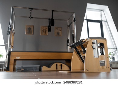 Pilates equipment. Reformer bed. Reformer pilates studio machine for fitness workouts in gym. Fit, healthy and strong authentical body. Fitness concept - Powered by Shutterstock