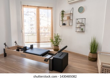 Pilates studio room with reformer beds
