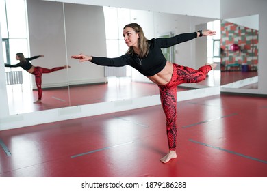 Pilates Trainer Girl Does Swallow Exercise In Fitness Studio With Mirrors