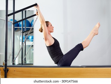 Pilates Woman In Reformer Teaser Exercise At Gym Indoor