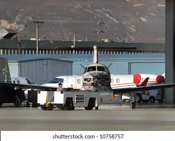 Pilatus Aircraft Being Towed Out From Hanger