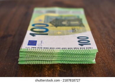 Pile Of 100 Euro Bank Notes On A Table