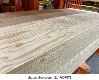 Pile Of 23-32 (18mm) 4x8 Radiata Pine Plywood Sheets On The Shelf In A Store. 