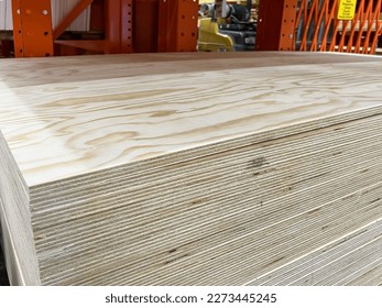 Pile of 23-32 (18mm) 4x8 Radiata Pine Plywood sheets on the shelf in a store. 