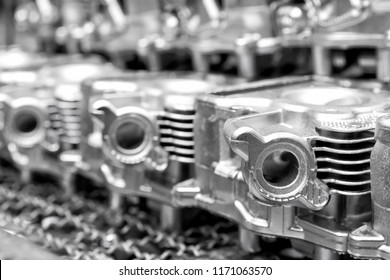 Pile of aluminum automotive parts head cylinder, casting process in the automotive industry factory - Shutterstock ID 1171063570