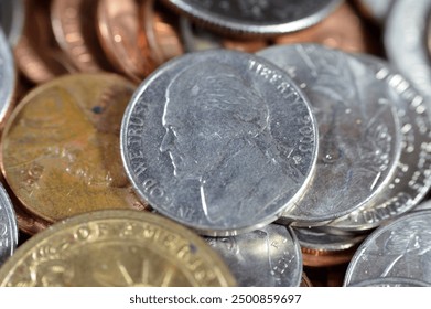 Pile of American coins of 1 cent, 5, 10, 25 cents quarter and one dollar, Vintage retro old American money background, United States of America dollars change coins, United States of America change