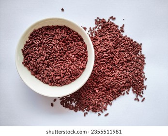 A Pile of Angkak or Red Fermented Rice Isolated in the White Background