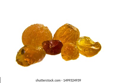 Pile of Arabic gum natural manna resin crystal, mana, senegal acacia. Nutritional edible aromatic health food from middle east. Selective focus.  Isolated on white background.