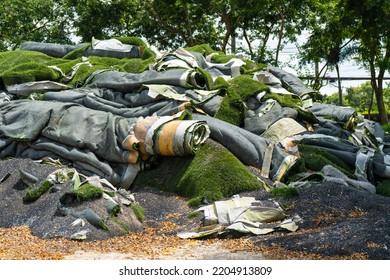 Pile of Artificial grass ,Rolls of synthetic turf removed were awaiting disposal or Recycled  - Shutterstock ID 2204913809
