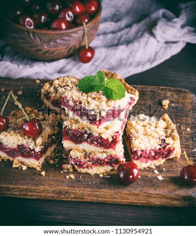 Similar – square pieces of cake crumble with cherry