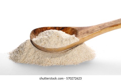 Pile Barley Flour And Wooden Spoon Isolated On White Background