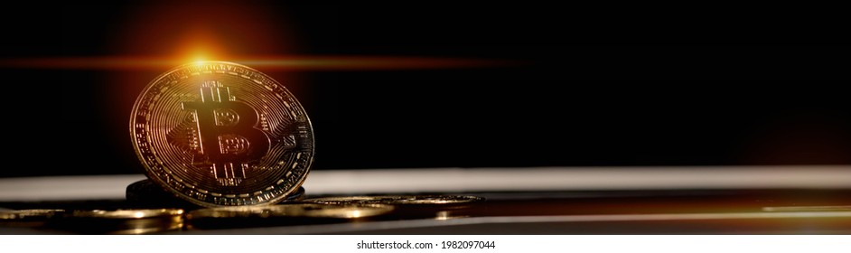 A Pile Of Bitcoin On Dark Ambient Background, With Edited Flare. Cryptocurrency Trading Concept, Good For Banner