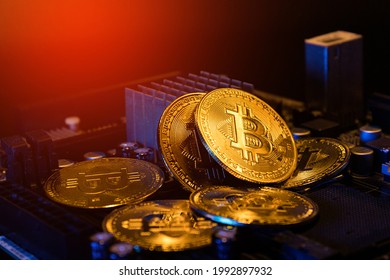 pile of bitcoins on computer mainboard. concept of crypto currency investment. - Powered by Shutterstock