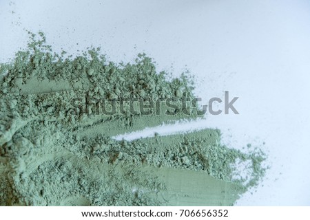 Pile of blue cosmetic clay isolated on white background