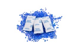 Pile Of Blue Silica Gel And Silica Gel Packaging Isolated On White Background