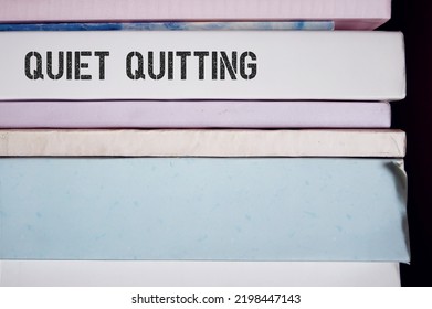 Pile Of Boks With Business Trendy Term QUIET QUITTING, Diminished Motivation And Low Engagement Gen Z Employees, Doing Only What Job Demands And Nothing More