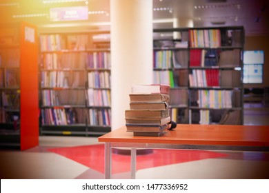 Pile Of Books On Study Desk In A Study Room. Education Or Academic Concept Picture Of Self Access Learning Environment Background Related To Research Or Reading Materials, Back To School Concept