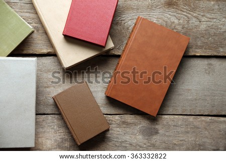 Pile of books on wooden background