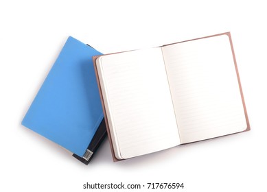 Pile of books and open note book isolated on white background. - Shutterstock ID 717676594