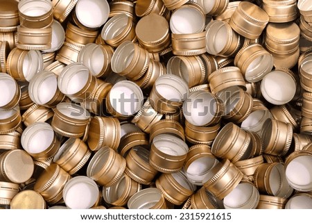 Pile of bottle metal screw caps as pattern background,