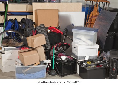Pile of boxes junk inside a residential garage. - Shutterstock ID 75056827