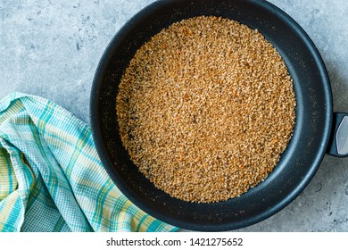 Pile Of Bread Crumbs Frying In Pan