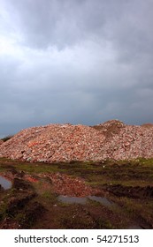 Pile Of Bricks And Dirt After And Before Storm