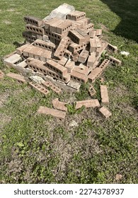 A pile of bricks at an empty construction site