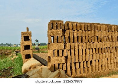 Pile of bricks in field