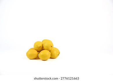 Pile of bright yellow lemon fruit on white background