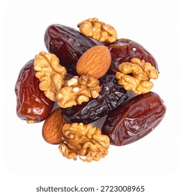 Pile of brown dates and assorted nuts including walnuts and almonds on a clean white background