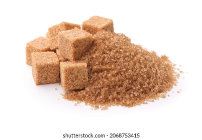 Pile of brown granulated sugar and sugar cubes isolated on white