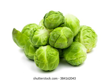 a pile of Brussels sprouts on a white background - Shutterstock ID 384162043