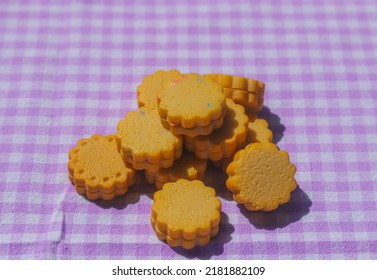 Pile Of Butter Cookies On A Purple Table Cloth