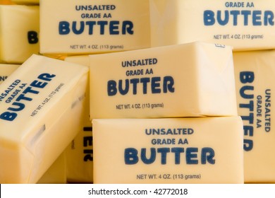 Download Pile Butter Sticks On Yellow Background Stock Photo Edit Now 42772018 PSD Mockup Templates