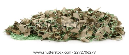 A pile of camouflage netting isolated on a white background.