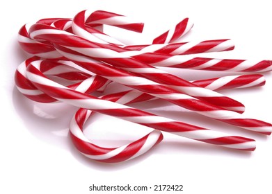 A Pile Of Candy Canes On A White Background.